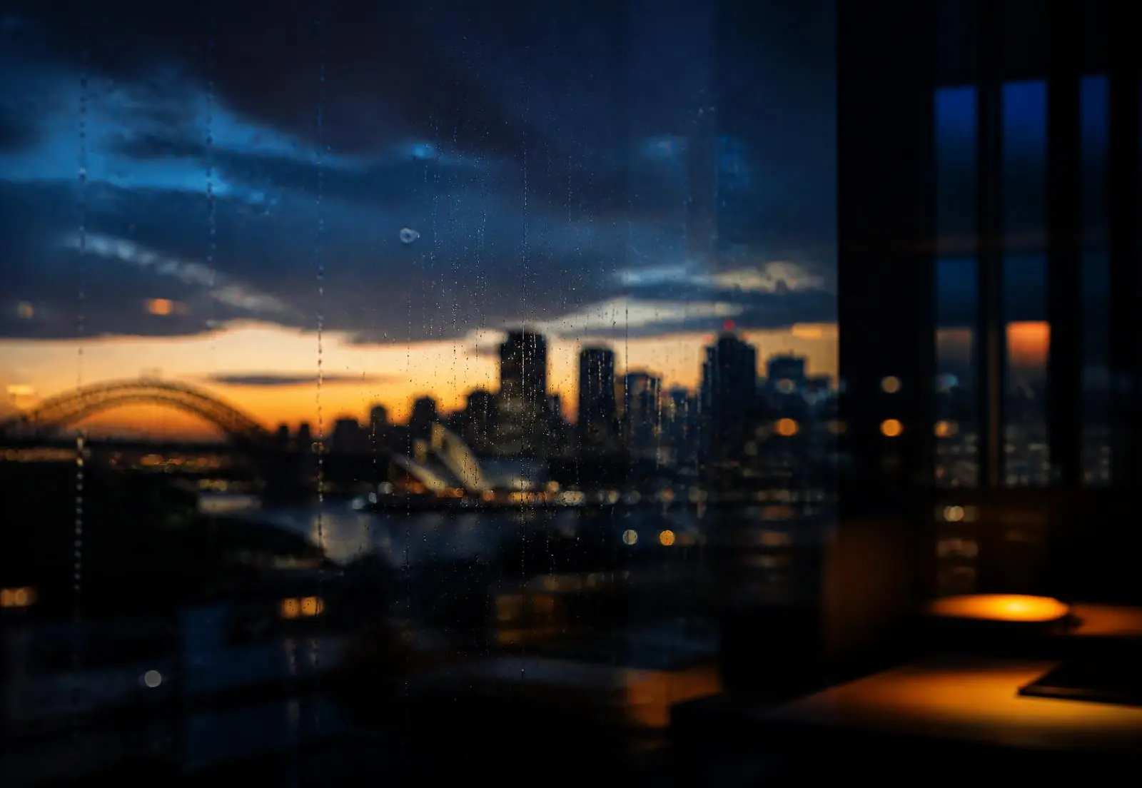 Sydney skyline at dusk viewed from an office window